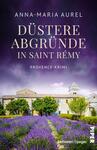 Das Buchcover zeigt eine malerische Landschaft in der Provence mit blühenden Lavendelfeldern im Vordergrund und einem historischen Gebäude im Hintergrund. Der Himmel ist in düsteren, violetten und grauen Tönen gehalten, was eine geheimnisvolle Atmosphäre schafft. Der Titel „Düstere Abgründe in Saint Rémy“ ist prominent in großen, weißen Buchstaben platziert, während der Untertitel „Provence-Krimi“ in einer kleineren Schrift darunter steht. Die Autorin Anna-Maria Aurel ist oben auf dem Cover genannt.