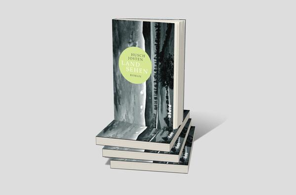 Bücherstapel des Buches „Land sehen“