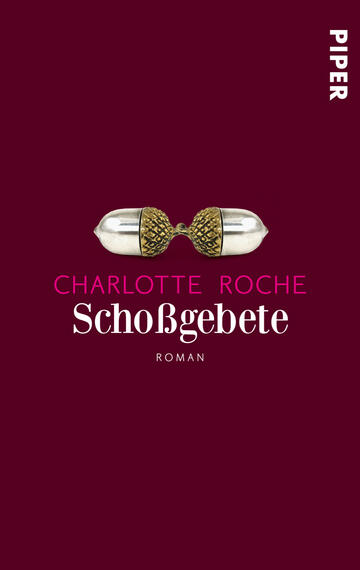 Das Buchcover zeigt einen tief roten Hintergrund. In der Mitte befindet sich eine stilisierte Darstellung einer Kapsel mit goldenen und weißen Elementen. Oberhalb der Kapsel steht in pinker Schrift „Charlotte Roche“, darunter in größerer, eleganter Schrift „Schoßgebete“ in Weiß. Am unteren Rand ist das Wort „Roman“ in kleinerer Schrift zu sehen. Die Gestaltung vermittelt eine moderne, provokante Atmosphäre.