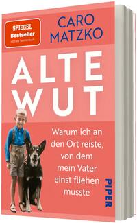 Das Buchcover zeigt ein zweifarbiges, lachsrosa-rotes Layout mit großem, weißem Titel „ALTE WUT“ in serifenloser Großschrift, darüber der Autorname „CARO MATZKO“ in dunklem Blau. Unten links eine kleine Fotomontage eines blonden Jungen in Hosenträgern neben einem schwarzen Hund. Rechts davon steht weißer Untertiteltext: „Warum ich an den Ort reiste, von dem mein Vater einst fliehen musste“. Kein Verlagslogo beschreiben.