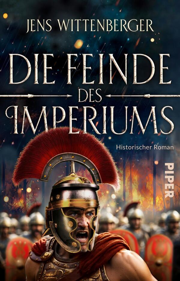 Das Buchcover zeigt einen wütenden römischen Soldaten in einem Glanzhelm mit rotem Wappen, der im Vordergrund steht. Im Hintergrund sind weitere Krieger und eine kämpferische Szenerie zu sehen, umgeben von einem spektakulären Himmel. Der Titel „Die Feinde des Imperiums“ ist in goldener, kraftvoller Schrift platziert, oben auf dem Cover. Darunter steht „Historischer Roman“. Das Cover strahlt eine dramatische und kämpferische Atmosphäre aus.