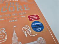 Außenansicht des Buches „The Score – Mitten ins Herz“