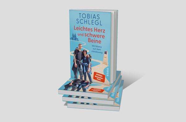 Bücherstapel des Buches „Leichtes Herz und schwere Beine“