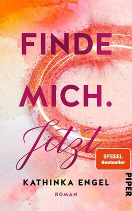 Das Buchcover zeigt einen farbenfrohen Hintergrund in sanften Wasserfarben, die in Orange- und Rosatönen dominieren. Im Zentrum steht der Titel „Finde mich. Jetzt“ in kräftigem Violett, wobei das Wort „Jetzt“ in einer verspielten, geschwungenen Schriftart gestaltet ist. Unterhalb des Titels ist der Autorenname „Kathinka Engel“ in schlichterer Schrift, während sich in der oberen Ecke ein Aufkleber mit der Aufschrift „SPIEGEL Bestseller“ befindet. Die Gesamtatmosphäre des Covers vermittelt eine einladende und inspirierende Stimmung.