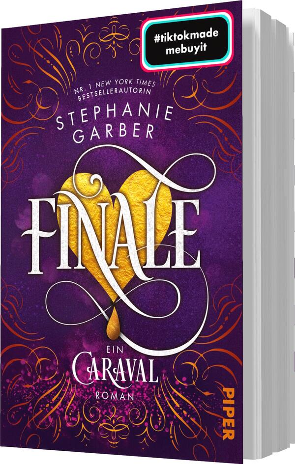Das Buchcover zeigt einen tiefvioletten Hintergrund mit goldenen, verschnörkelten Elementen. Im Mittelpunkt steht der Titel „FINALE“, der in großen, geschwungenen weißen Buchstaben geschrieben ist. Darunter befindet sich der Untertitel „ein Caraval Roman“ in klarer Schrift. Ein herzförmiges, gelbes Element ergänzt das Design. Oben auf dem Cover prangt der Name der Autorin „Stephanie Garber“. In der oberen Ecke befindet sich ein bunter Button mit dem Text „#tiktokmade mebuyit“.