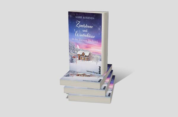 Bücherstapel des Buches „Zimtsterne und Winterküsse in der kleinen Bäckerei“