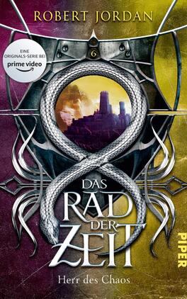 Das Rad der Zeit 6 Das Buchcover zeigt einen fantasievollen und mystischen Hintergrund in lila und gelben Farbtönen. In der Mitte ist ein geschwungener, silberner Schriftzug „DAS RAD DER ZEIT“ platziert, darüber der Autorname „ROBERT JORDAN“ in einer klaren Schriftart. Ein leuchtender, halbkugeliger Bereich mit einer stilisierten Szenerie ist im Hintergrund sichtbar, umgeben von detaillierten, grafischen Elementen, die an das Thema Chaos und Macht erinnern. Oben links befindet sich ein Hinweis auf die Original-Serie bei Prime Video.