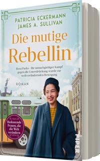 Das Buchcover zeigt eine Frau mit dunklen Haaren, die einen blauen Mantel trägt, vor einer historischen Straßenbahn. Der Hintergrund ist hellblau, was eine luftige Atmosphäre schafft. Der Titel „Die mutige Rebellin“ ist in großer, orangefarbener Schrift prominent platziert. Darunter steht in kleinerer Schrift der Untertitel „Rosa Parks – Ihr unnachgiebiger Kampf gegen die Unterdrückung wurde zur weltverändenden Bewegung“. Am unteren Rand befindet sich ein violettes Feld mit dem Text „Bedeutende Frauen, die die Welt verändern“.