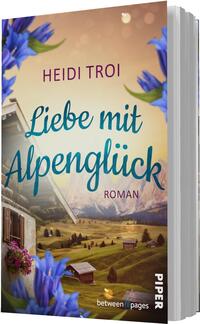 Das Buchcover zeigt eine idyllische alpine Landschaft mit sanften Hügeln und einem Blick auf majestätische Berge im Hintergrund. Im Vordergrund sind blühende Pflanzen in leuchtendem Blau zu sehen. Der Titel „Liebe mit Alpen-Glück“ ist in geschwungener, turquoise Schrift platziert, während der Name der Autorin „Heidi Troi“ in einer höheren, klaren Schrift darüber steht. Die warme Farbpalette vermittelt eine einladende und romantische Atmosphäre.