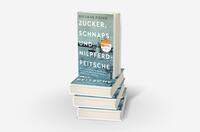 Bücherstapel des Buches „Zucker, Schnaps und Nilpferdpeitsche“