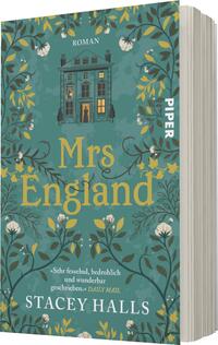 Das Buchcover zeigt ein elegantes, altmodisches Haus in der Mitte, umgeben von üppigem, detailliertem Blumendesign in Grün- und Pastelltönen. Der Titel „Mrs England“ steht in großen, goldenen Buchstaben im unteren Bereich. Oben befindet sich das Wort „ROMAN“ in einer schlichten Schriftart. Im oberen Teil des Covers ist ein Fenster sichtbar, hinter dem eine schemenhafte Figur steht. Ein Zitat aus der „DAILY MAIL“ befindet sich unten auf dem Cover, das die fesselnde und geheimnisvolle Atmosphäre des Buches unterstreicht.