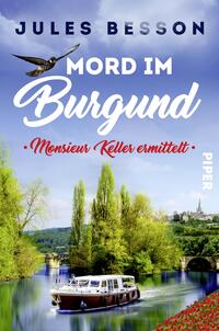 Das Buchcover zeigt eine idyllische Landschaft mit einem ruhigen Gewässer und üppigem Grün. Im oberen Bereich fliegt ein Vogel über das Bild. Der Titel „Mord im Burgund“ ist in großen, geschwungenen weißen Buchstaben dargestellt, während der Untertitel „Monsieur Keller ermittelt“ in roter Schrift darunter steht. Der Autorname „Jules Besson“ befindet sich oben in einer klaren, modernen Schrift. Der Hintergrund ist harmonisch in sanften Blautönen gehalten, was eine entspannte, mysteriöse Atmosphäre vermittelt.