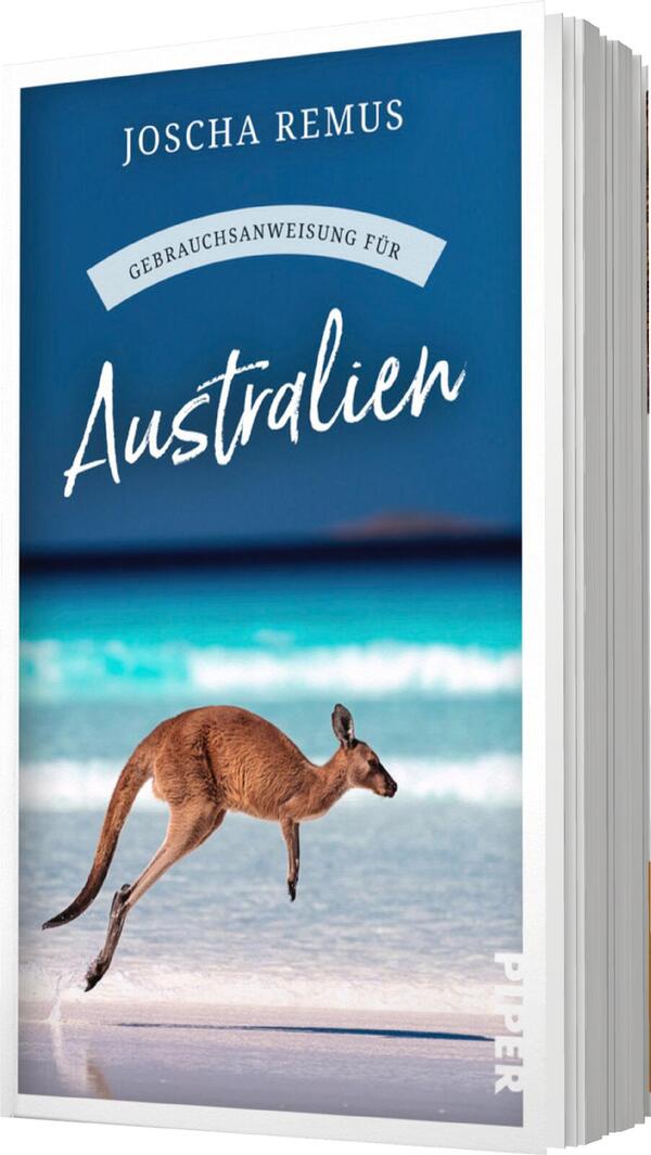 Das Buchcover zeigt einen klaren, blauen Himmel sowie einen sandigen Strand mit türkisfarbenem Wasser. Im Vordergrund springt ein Känguru über den Sand, was Dynamik und Abenteuerlust vermittelt. Der Titel „Gebrauchsanweisung für Australien“ ist in eleganter, geschwungener Schrift in Weiß gehalten, während der Autorname „Joscha Remus“ oben auf dem Cover in schlichter, klarer Schrift steht. Die Farbgestaltung erzeugt eine einladende, sommerliche Atmosphäre.