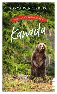 Das Buchcover zeigt einen aufrechten Braunbären vor einer üppigen, grünen Waldlandschaft. Der Titel „Kanada“ ist in großem, weißem Schriftzug in einer dynamischen Schriftart gestaltet und wird von einer roten Bannerüberschrift mit dem Text „Gebrauchsanweisung für“ akzentuiert. Die Farbpalette des Covers vermittelt eine natürliche, rustikale Atmosphäre und weckt Interesse an den landschaftlichen und kulturellen Aspekten Kanadas. Der Autorinnenname „Sonya Winterberg“ steht in schlichter, heller Schrift am oberen Rand.