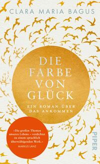 Das Buchcover zeigt einen goldenen Kreis, der von fliegenden Vögeln in verschiedenen Größen umgeben ist. Der Titel „Die Farbe von Glück“ ist in großen, weißen Buchstaben zentral platziert. Darunter steht in kleinerer Schrift „Ein Roman über das Ankommen“. In der unteren linken Ecke befindet sich ein rotes Rechteck mit weißem Text, das eine kurze Empfehlung enthält. Der Hintergrund ist in sanften, hellen Farben gehalten, was eine positive und hoffnungsvolle Atmosphäre vermittelt.