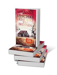Bücherstapel des Buches „Deine Welt wird brennen“