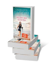 Bücherstapel des Buches „Heldin der Gezeiten – Eine Schwimmerin. Ein Ziel. Ein weltweiter Erfolg.“