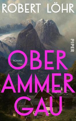 Das Buchcover zeigt eine eindrucksvolle alpine Landschaft mit markanten Berggipfeln im Hintergrund. Im Vordergrund sind traditionsreiche Holzhäuser zu sehen. Der Titel „OBERAMMERGAU“ ist in großen, leuchtend pinken Buchstaben gestaltet, während darunter das Wort „ROMAN“ in einer schmaleren, eleganten Schrift steht. Der Autor „ROBERT LÖHR“ ist in weißen, klaren Buchstaben am oberen Rand platziert. Die Farbgebung und Komposition vermitteln eine einladende, zugleich mystische Atmosphäre.