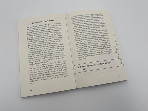 Innenansicht des Buches „Pfoten vom Tisch!“
