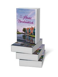 Bücherstapel des Buches „Das kleine Haus mit Nordseeblick“