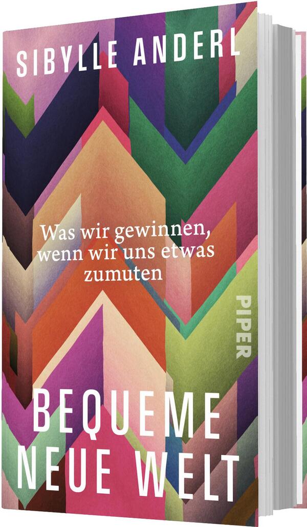 Das Buchcover zeigt ein dichtes, geometrisches Zickzackmuster aus kräftigen, flächigen Farben – Pink, Magenta, Orange, Grün, Lila, Dunkelblau und Beige. Oben steht der Autorenname Sibylle Anderl in großen weißen Versalien, mittig die kleinere weiße Zeile „Was wir gewinnen, wenn wir uns etwas zumuten“, unten der großformatige Titel „Bequeme neue Welt“ in fett gesetzten weißen Großbuchstaben. Die Wirkung ist dynamisch und optimistisch.