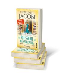 Bücherstapel des Buches „Die Patisserie am Münsterplatz – Neuanfang “