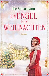 Das Buchcover zeigt eine winterliche Szenerie mit einem festlich geschmückten Baum im Vordergrund. In der Mitte steht eine Frau mit roten Lippen, die ein rotes Kleid und einen grauen Schal trägt. Ihr Blick ist nachdenklich und romantisch. Im Hintergrund sind schneebedeckte Gebäude und ein Himmel mit Schneeflocken sichtbar. Der Titel „Ein Engel für Weihnachten“ ist in großen, roten Buchstaben oben platziert, während der Autor Ute Scharmann darunter steht. Am unteren Rand befindet sich das Wort „Roman“ in kleinerer Schrift.
