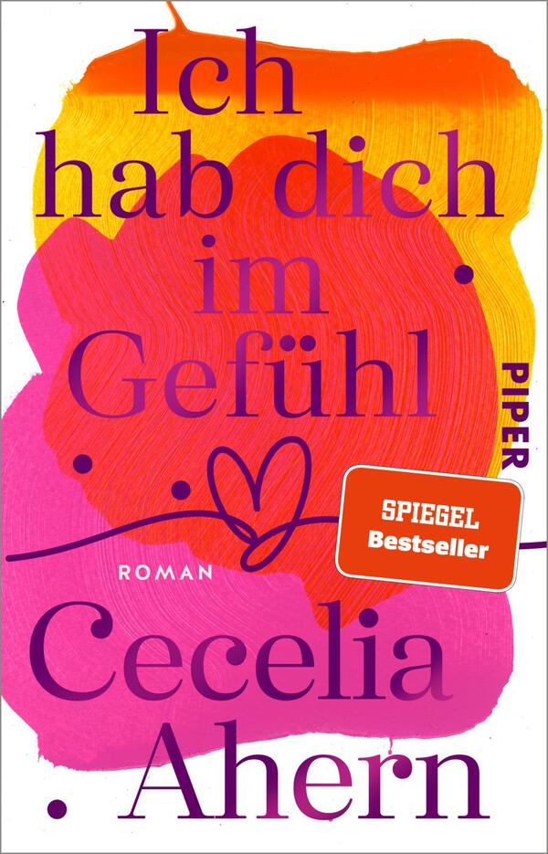 Das Buchcover zeigt einen bunten, abstrakten Hintergrund in warmen Farbtönen von Orange, Rosa und Lila. In der Mitte steht der Titel „Ich hab dich im Gefühl“ in großen, lila Buchstaben, unter dem sich das Wort „Roman“ in kleinerer Schrift befindet. Darunter ist der Name der Autorin „Cecelia Ahern“ in auffälliger, schriftlicher Gestaltung. Ein rotes Kästchen am oberen Rand weist auf „SPIEGEL Bestseller“ hin. Die Atmosphäre des Covers ist lebhaft und emotional.