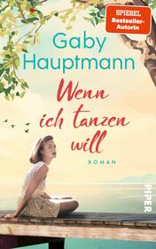 Das Buchcover zeigt eine nachdenklich wirkende junge Frau, die auf einer Treppe sitzt. Sie trägt ein helles Oberteil und hat lockiges, kinnlanges Haar. Der Hintergrund zeigt einen sanften Sonnenuntergang mit warmen Pastellfarben und einem grünen Baum. Der Titel „Wenn ich tanzen will“ ist in geschwungener Schrift rot dargestellt, während der Name der Autorin, Gaby Hauptmann, in klaren, blauen Buchstaben oben auf dem Cover platziert ist. Am oberen Rand befindet sich der Hinweis „SPIEGEL Bestseller-Autorin“ in weißer Schrift auf rotem Hintergrund. Der Verlag wird durch das Logo „PIPER“ am rechten unteren Rand angezeigt.
