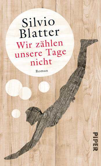 Das Buchcover zeigt einen Taucher in dynamischer Pose, der sich in einen hellen, runden Bereich mit einem Holzmaserungshintergrund stürzt. Der Titel „Wir zählen unsere Tage nicht“ ist in roter Schrift mittig platziert, während der Autorennamen „Silvio Blatter“ in schwarzer, eleganter Schrift oberhalb steht. Neben dem Taucher befinden sich zwei weiße Blasen, die eine luftige Atmosphäre erzeugen. Am unteren Rand ist das Verlagslogo „PIPER“ in grauer Schrift sichtbar.