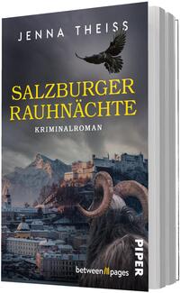 Das Buchcover zeigt den Autorennamen Jenna Theiss oben in weißen Großbuchstaben, darunter der Titel „SALZBURGER RAUHNÄCHTE“ in großen gelben Lettern und die Unterzeile „Kriminalroman“ in weiß. Szenerie: düster-blaugraue Winterlandschaft mit Salzburger Stadtbild und Festung, schneebedeckte Berge im Hintergrund. Im Vordergrund eine Gestalt mit Fell und großen, gekrümmten Hörnern sowie ein fliegender Rabe. Stimmung: geheimnisvoll, bedrohlich, kalt.