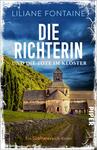 Das Buchcover zeigt eine malerische Klosterkirche in einer ländlichen Umgebung, umgeben von sanften Hügeln und Bäumen. Der Himmel ist strahlend blau, was eine ruhige Atmosphäre vermittelt. In großen, weißen Buchstaben steht der Titel „DIE RICHTERIN“ über dem Kloster, während darunter in etwas kleineren, gelben Buchstaben „und die Tote im Kloster“ zu lesen ist. Der Autorinnenname „Liliane Fontaine“ befindet sich am oberen Rand. Das Cover ist im Stil eines Krimis gehalten und weckt Neugier auf die Geschichte.
