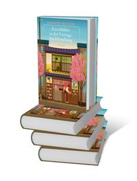 Bücherstapel des Buches „Kirschblüte in der Freitagsbuchhandlung“