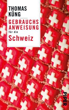Das Buchcover zeigt eine bunte Anordnung von roten und weißen Zuckerstücken, die die Schweizer Flagge symbolisieren. Im oberen Bereich ist der Autorenname „Thomas Küng“ in schwarzer Schrift präsent, darunter steht in großer, roter Schrift „GEBRAUCHSANWEISUNG“ und in kleinerer, grauer Schrift „für die Schweiz“. Der Hintergrund ist lebhaft, was eine freundliche und einladende Atmosphäre schafft. Das Cover vermittelt eine leichte, humorvolle Herangehensweise an das Thema.