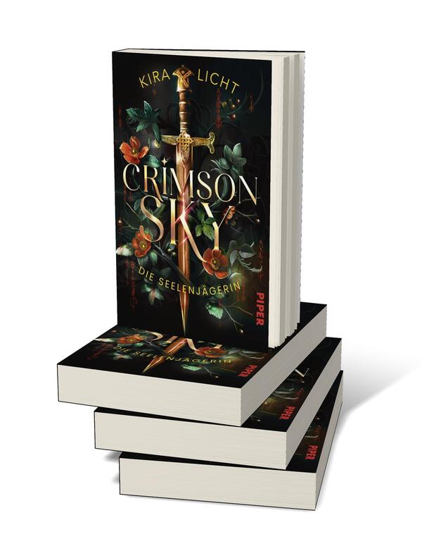 Bücherstapel des Buches „Crimson Sky – Die Seelenjägerin“