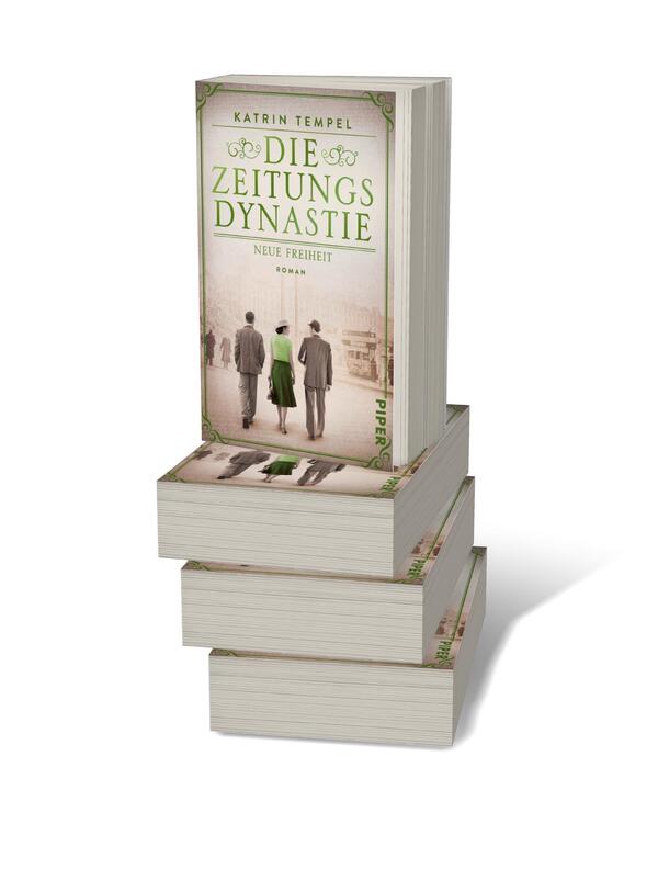 Bücherstapel des Buches „Die Zeitungsdynastie – Neue Freiheit“