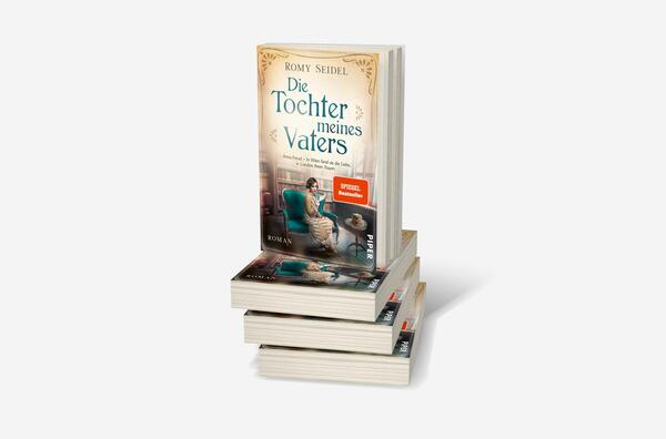 Bücherstapel des Buches „Die Tochter meines Vaters“