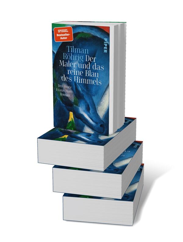 Bücherstapel des Buches „Der Maler und das reine Blau des Himmels“