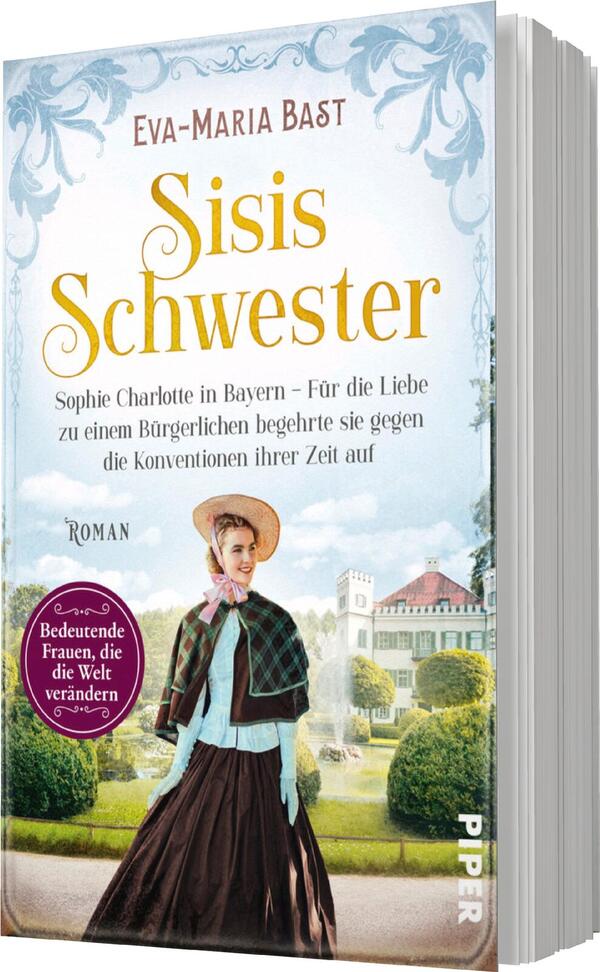 Das Buchcover zeigt eine nostalgische Szenerie mit einer historischen Frau in einem eleganten Kleid und Hut. Sie steht im Vordergrund und blickt nachdenklich in die Ferne. Im Hintergrund sind ein Schloss und Gärten angedeutet, die eine verträumte Stimmung vermitteln. Der Titel „Sisis Schwester“ ist in großen, goldenen Buchstaben platziert, darunter der Untertitel mit dem Hinweis auf die Protagonistin. Ein rundes, lila Banner auf der linken Seite trägt den Text „Bedeutende Frauen, die die Welt verändern“.