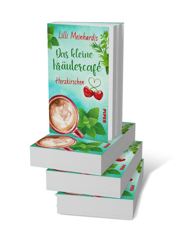 Bücherstapel des Buches „Das kleine Kräutercafé – Herzkirschen“