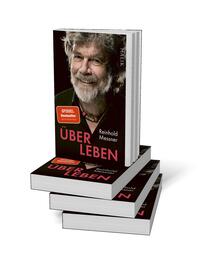 Bücherstapel des Buches „Über Leben“