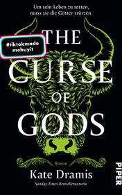 Das Buchcover zeigt einen schwarzen Hintergrund, vor dem ein stilisierter, grüner Wolfskopf prominent in der Mitte platziert ist. Der Titel „THE CURSE OF GODS“ erscheint in großem, weißem Schriftzug, während der Untertitel „Roman“ in kleineren Buchstaben darunter steht. Der Autorinnenname „Kate Dramis“ ist ebenfalls in Weiß und auffällig platziert. In der oberen linken Ecke befindet sich ein weißer Kreis mit dem Text „Vorläufiges Cover“. Ein mehrfarbiger, rechteckiger Button mit dem Hashtag „#tiktokmade mebuyit“ ist am unteren Rand des Covers angebracht. Die Atmosphäre ist mystisch und düster.