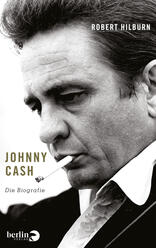 Das Buchcover zeigt ein Porträt von Johnny Cash in Schwarz-Weiß, das seine markanten Gesichtszüge betont. Er hält eine Zigarette zwischen den Lippen und schaut nachdenklich. Der Titel „JOHNNY CASH“ ist in großen, goldenen Buchstaben platziert, während „Die Biografie“ darunter in schlichter Schrift steht. Den oberen Teil des Covers nimmt der Name des Autors, Robert Hilburn, in heller Schrift ein. Die nüchterne Farbgestaltung und der Fokus auf Cash vermitteln eine melancholische und nostalgische Atmosphäre.