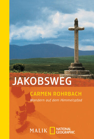 Das Buchcover zeigt eine farbenfrohe Landschaft mit einer steinernen Kreuzfigur im Vordergrund. Der Himmel ist blaugrau, während die Hügel im Hintergrund in sanften Grüntönen dargestellt sind. Der Titel „JAKOBSWEG“ erscheint in großer, weißer Typografie, darüber steht der Name der Autorin „Carmen Rohrbach“ in etwas kleinerer Schrift. Am unteren Rand findet sich der Untertitel „Wandern auf dem HimmelsPfad“ in orangefarbener Schrift auf einem gelben Hintergrund. Die Atmosphäre vermittelt einen einladenden und abenteuerlichen Charakter.
