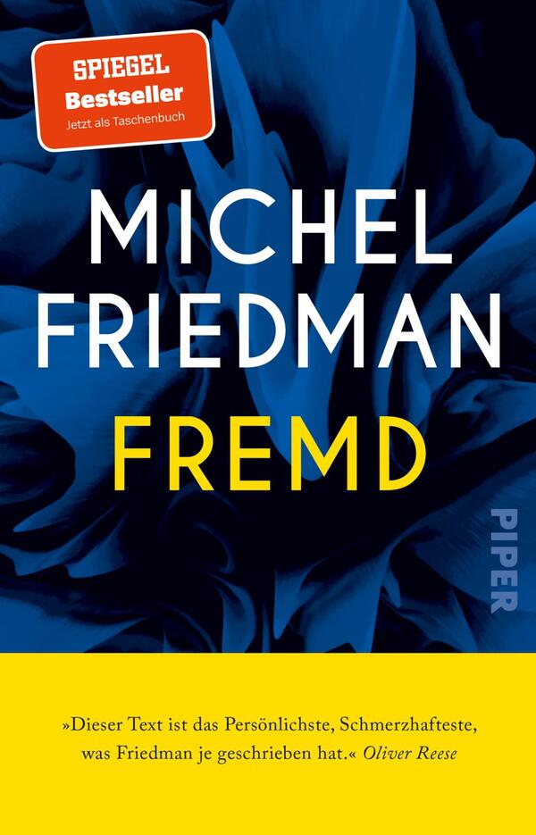 Das Buchcover zeigt eine lebendige, tiefblaue Hintergrundfarbe, die teilweise von stilisierten floralen Elementen durchzogen ist. Der Titel „FREMDS“ von Michel Friedman ist in großen, weißen Buchstaben auf dünnem gelben Hintergrund platziert, was einen starken Kontrast erzeugt. Oben links befindet sich ein rotes Label, das auf den Bestseller-Status hinweist, mit dem Text „JETZT als Taschenbuch“. Unten rechts steht der Name des Verlags „PIPER“ in kleinerer Schrift.