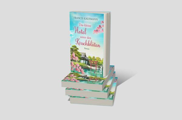 Bücherstapel des Buches „Das kleine Hotel unter den Kirschblüten“